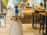 The Innovation Café in Tokyo. A robot waiter navigates a restaurant.